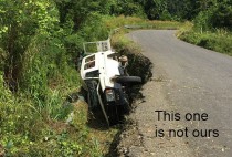 Dangers of driving on PNG roads (not our car though)
