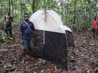 Jonah Filip monitoring insects using Malaise trap.